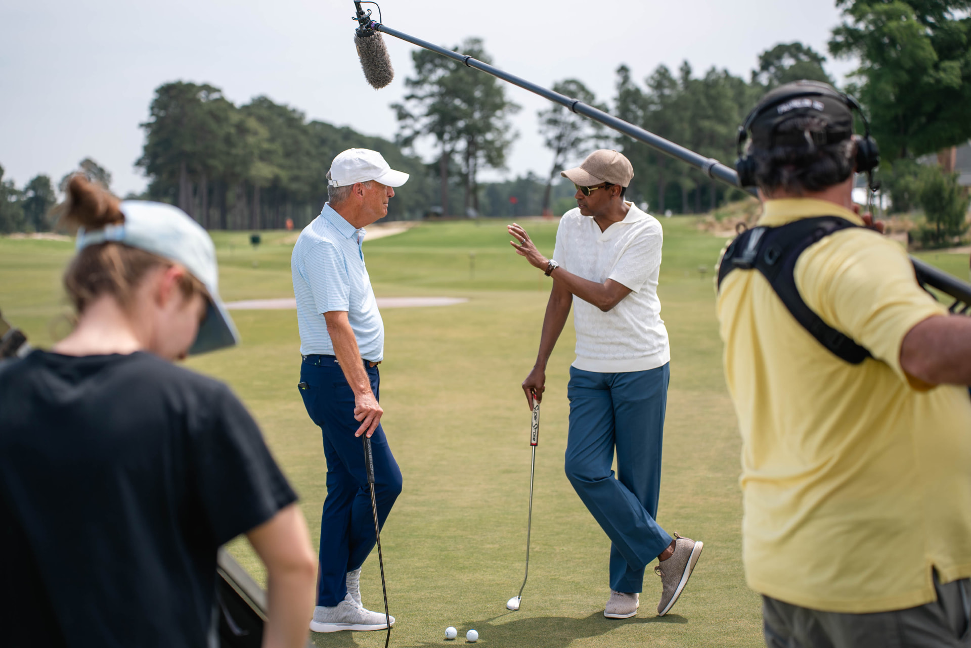 Dwayne Ballen interviewing a golfer during an outdoor television production